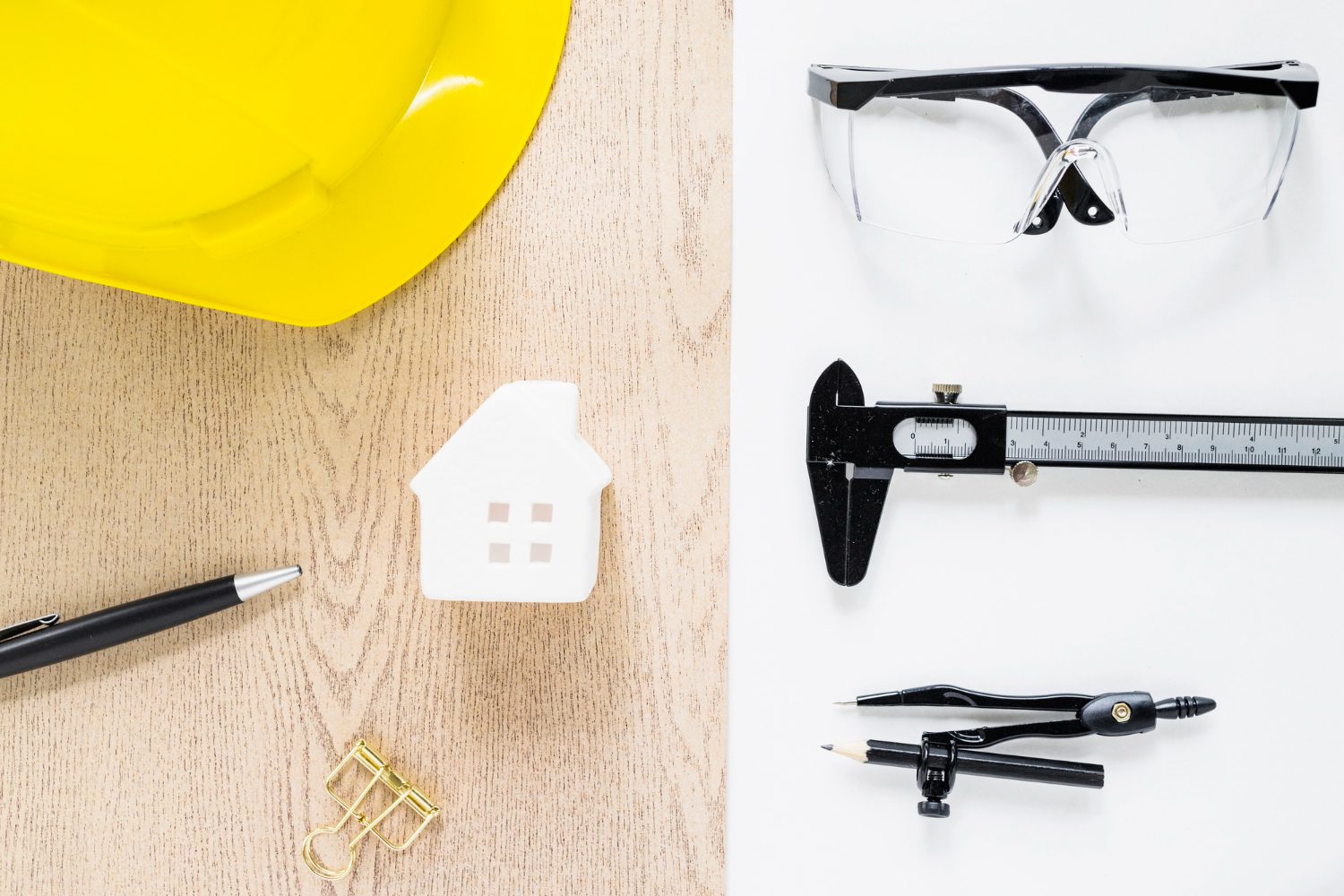 Workers securing an unfinished house at a construction site to prevent theft and damage