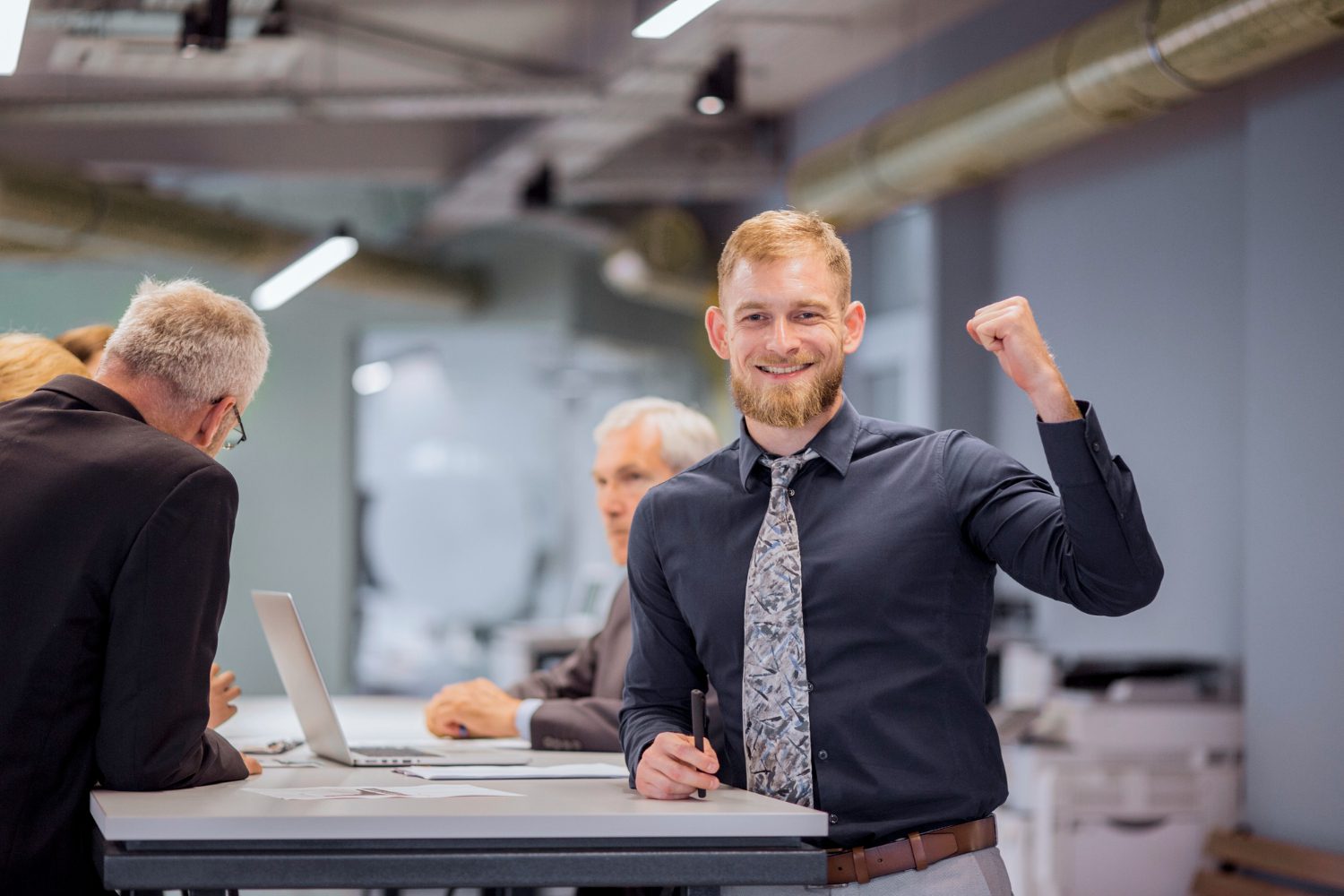 Sales manager presenting strategy to team in modern office environment